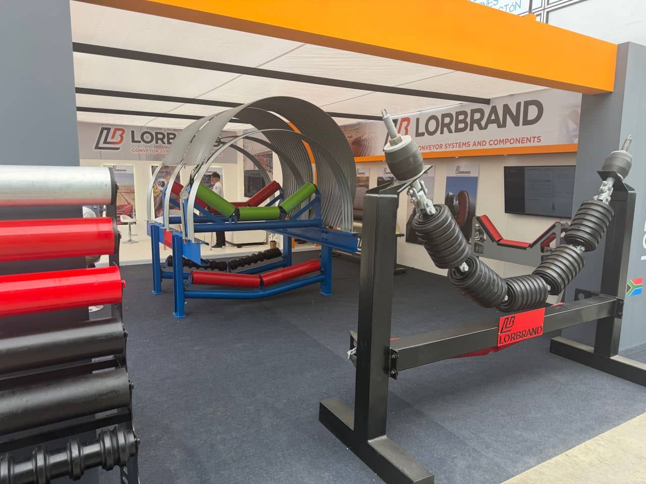 Garland impact idler and troughed carry idler on the Lorbrand stand at EXPONOR 2026