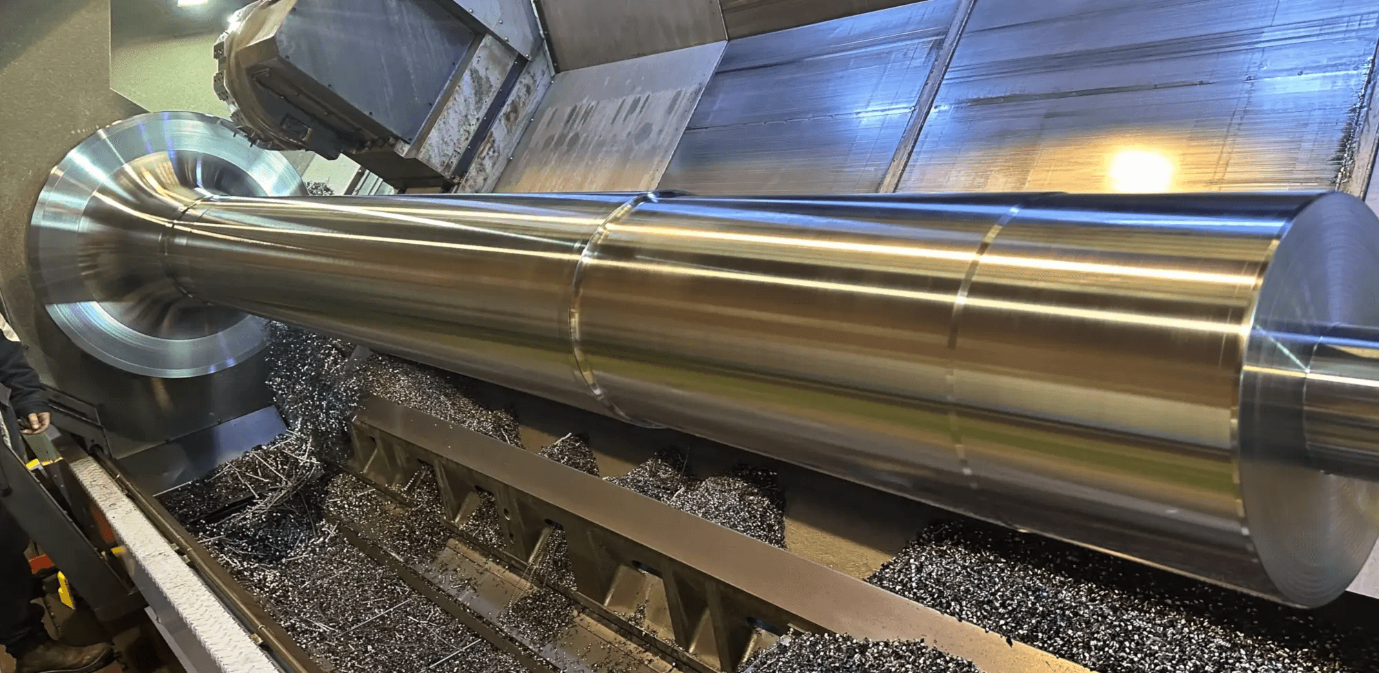 Large pulley shaft being machined